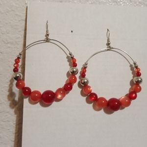 Hoop earrings with red beads